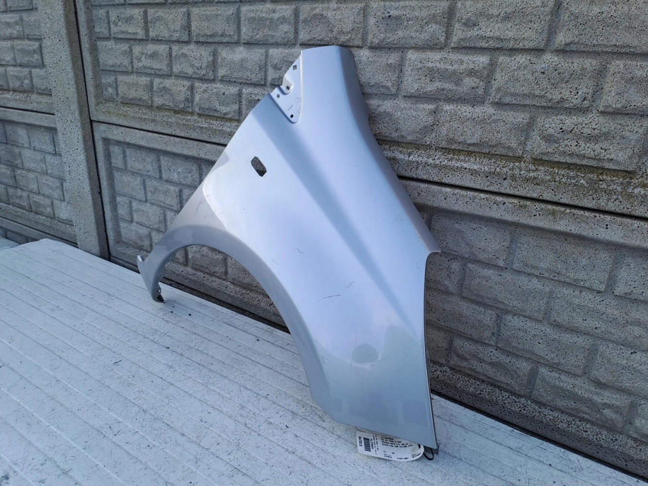 NISSAN NOTE 2006 - 2012 BŁOTNIK PRZEDNI PRAWY - (15218453703)