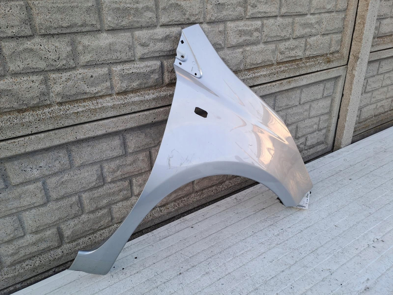 NISSAN NOTE 2006 - 2012 BŁOTNIK PRZEDNI PRAWY - (15218453703)