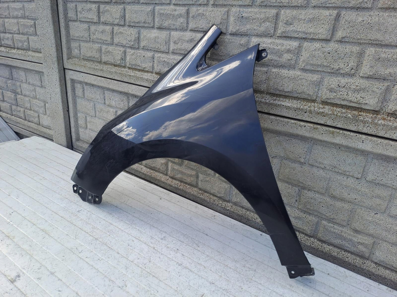 TOYOTA VERSO LIFT BŁOTNIK PRZEDNI LEWY - (15492900327)