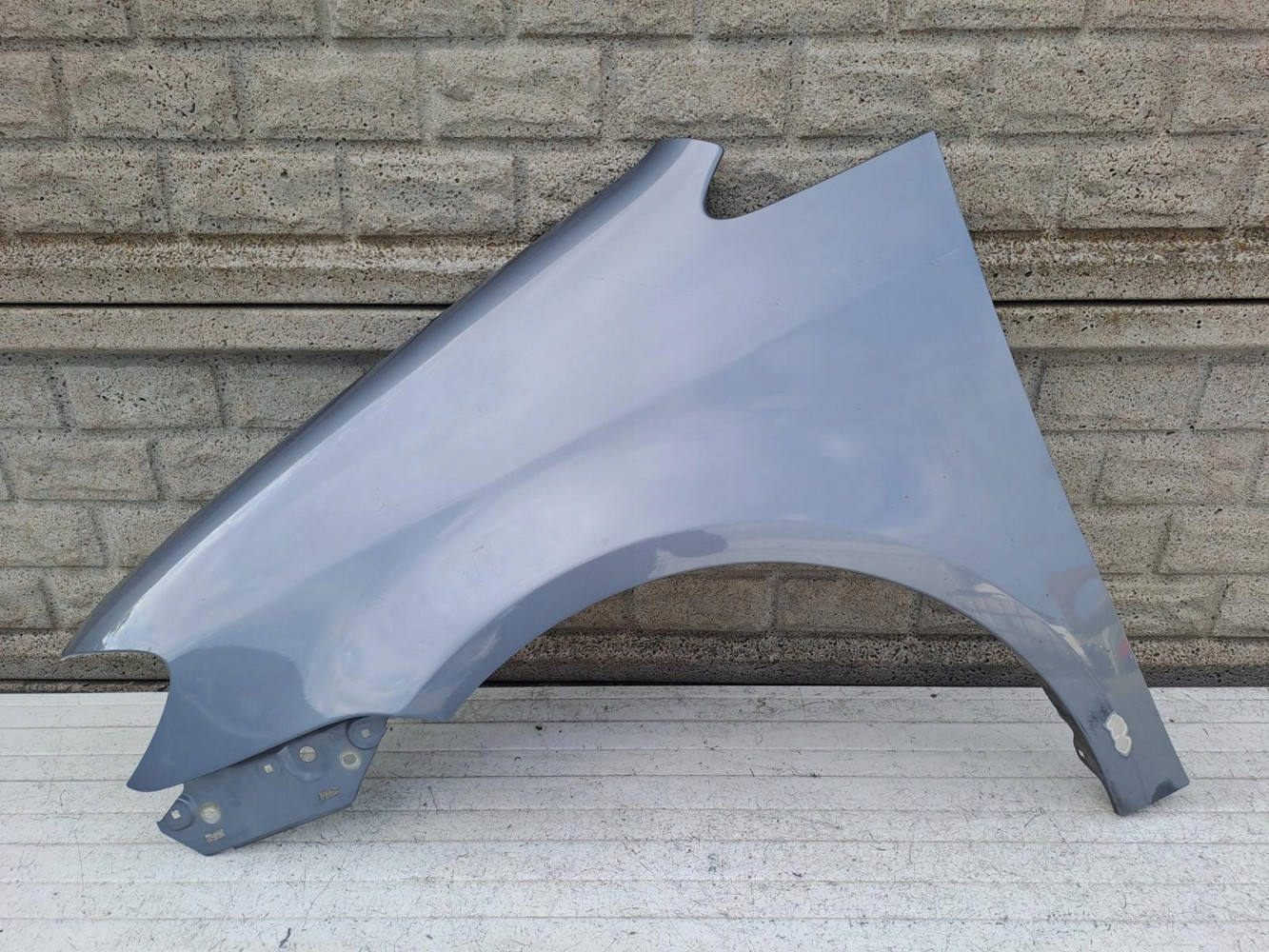 VW TOURAN LIFT BŁOTNIK LEWY 2007-2010 - (15542591029)