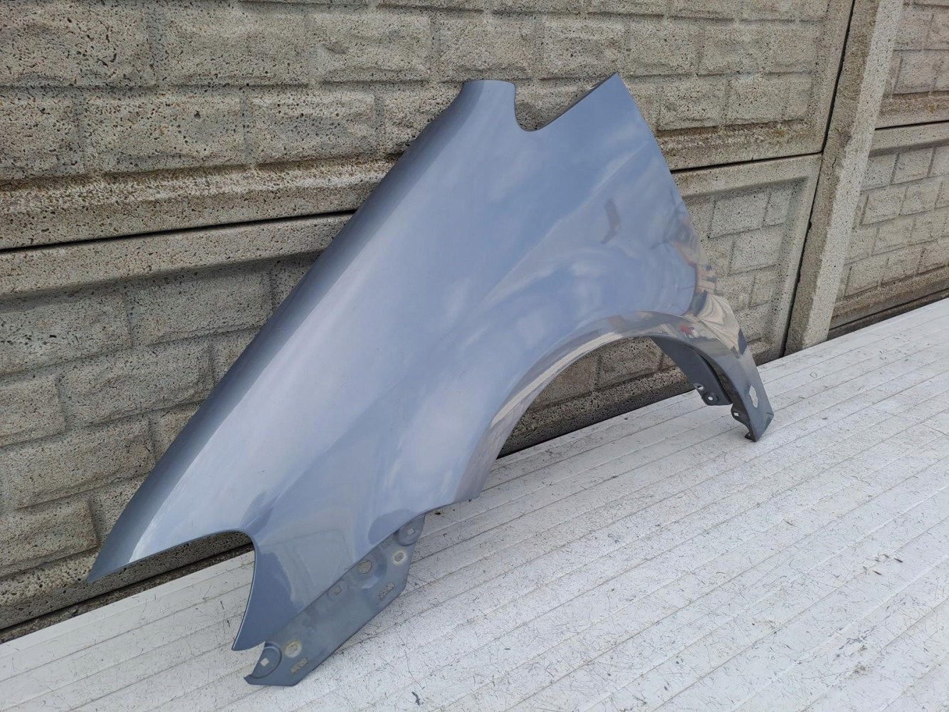 VW TOURAN LIFT BŁOTNIK LEWY 2007-2010 - (15542591029)