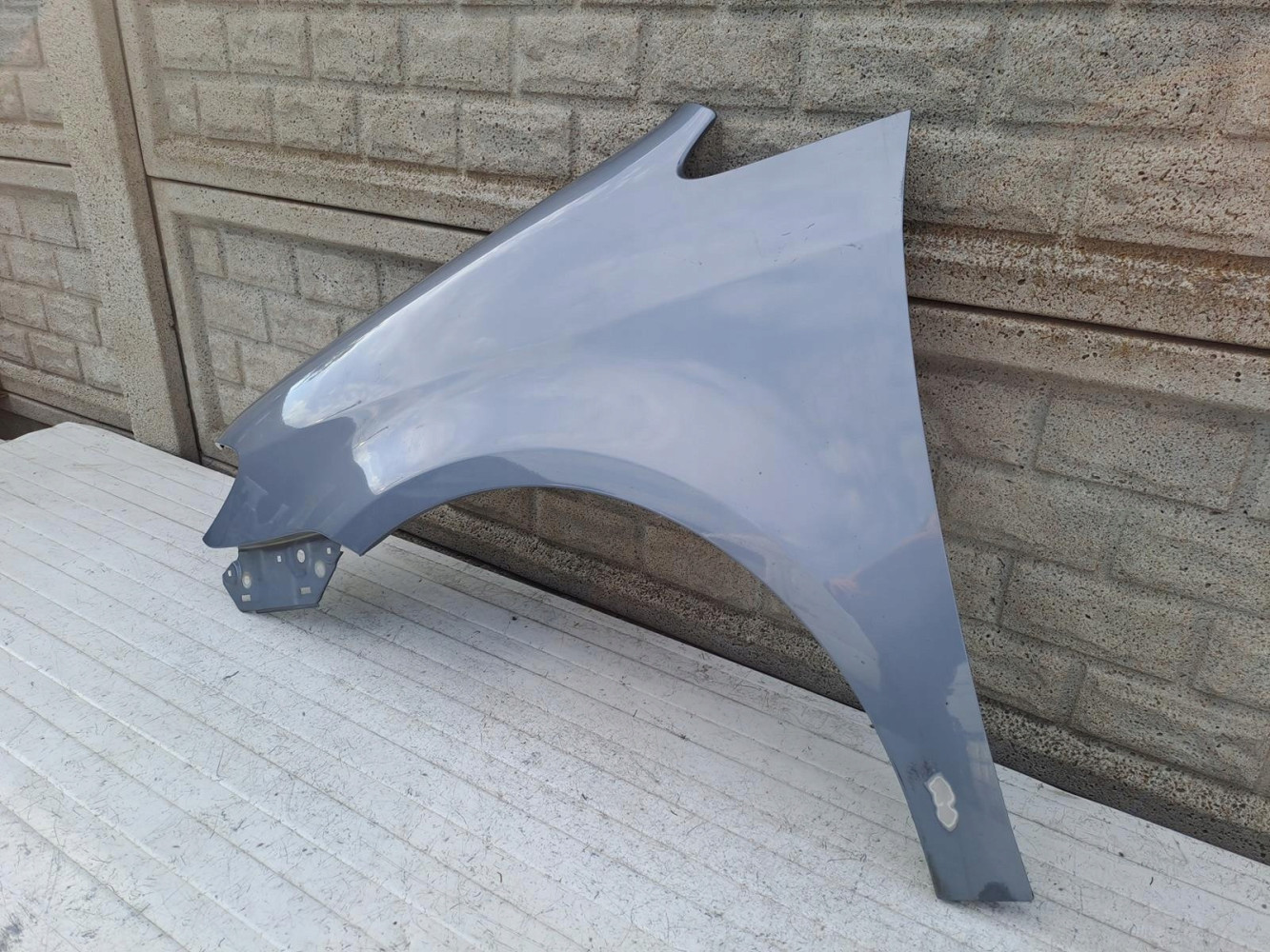 VW TOURAN LIFT BŁOTNIK LEWY 2007-2010 - (15542591029)