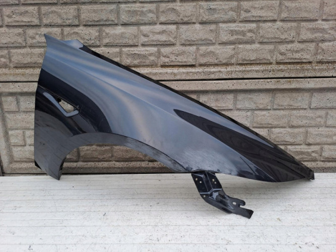TESLA 3 III 2024- BŁOTNIK PRZEDNI PRAWY - (15655240794)
