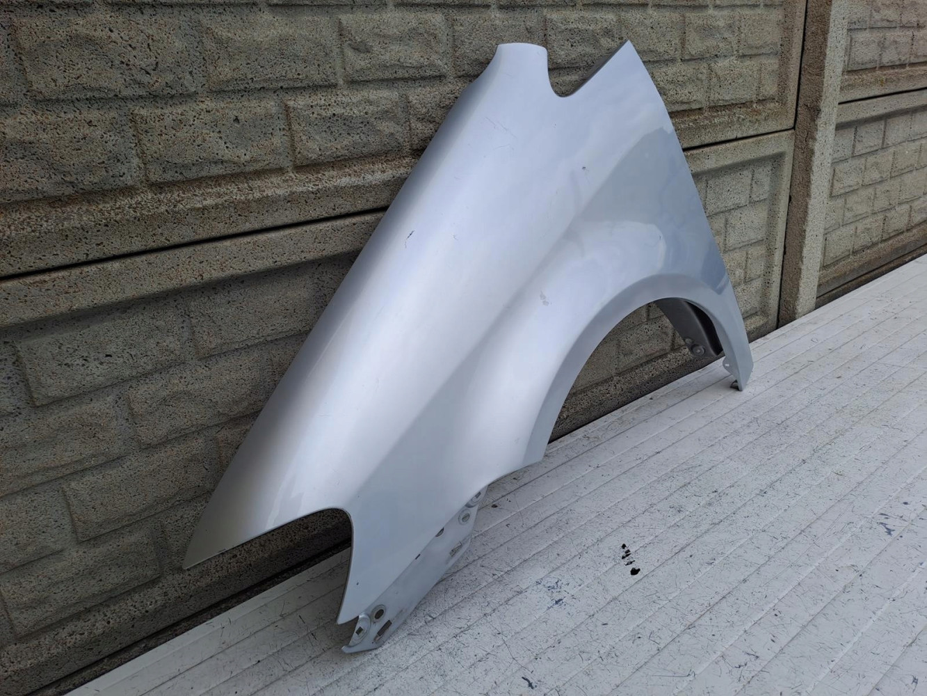 VW TOURAN LIFT BŁOTNIK LEWY 2007-2010 - (15685307221)