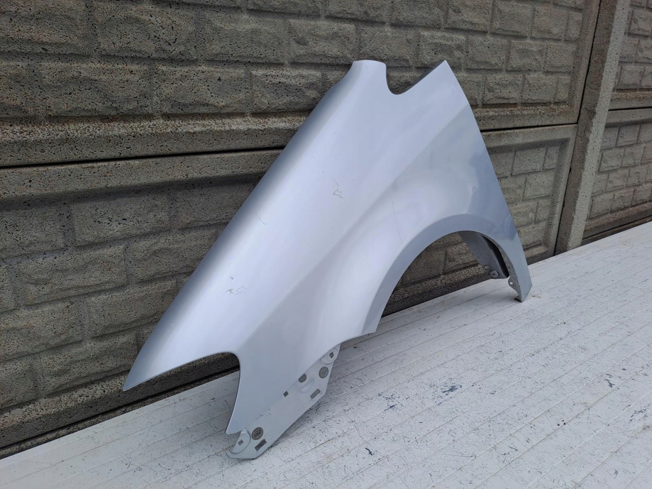VW TOURAN LIFT BŁOTNIK LEWY 2007-2010 - (15983031015)