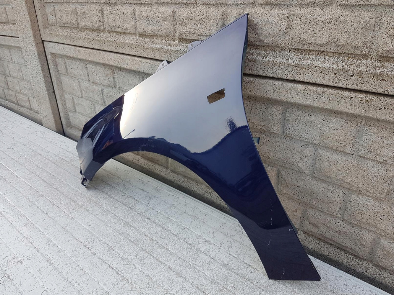 OPEL ADAM BŁOTNIK PRZEDNI LEWY