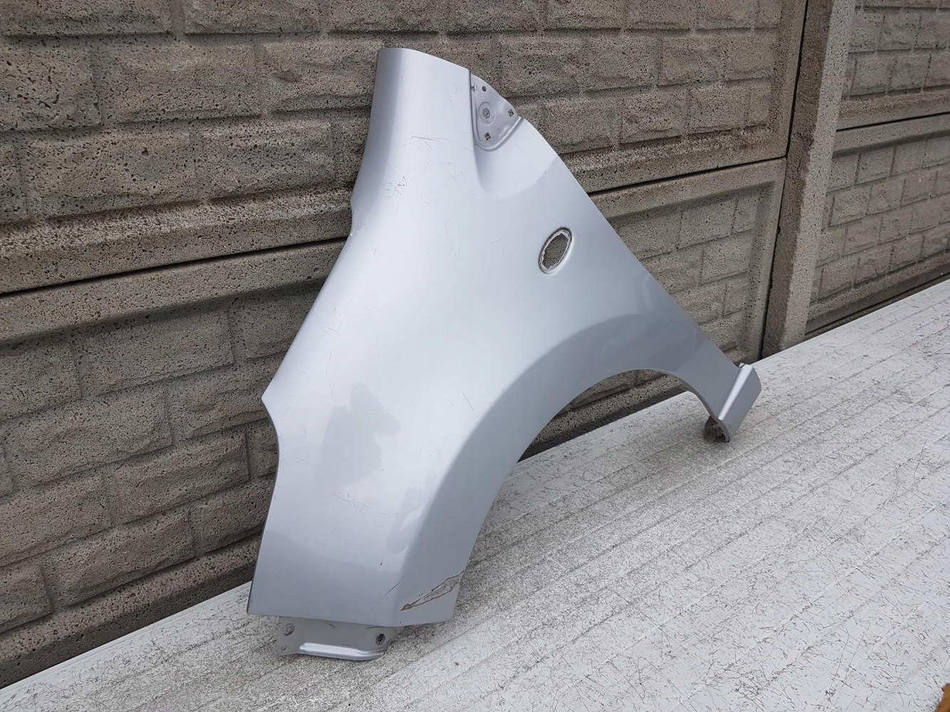 NISSAN PIXO SUZUKI ALTO BŁOTNIK LEWY PRZEDNI - (11973490127)