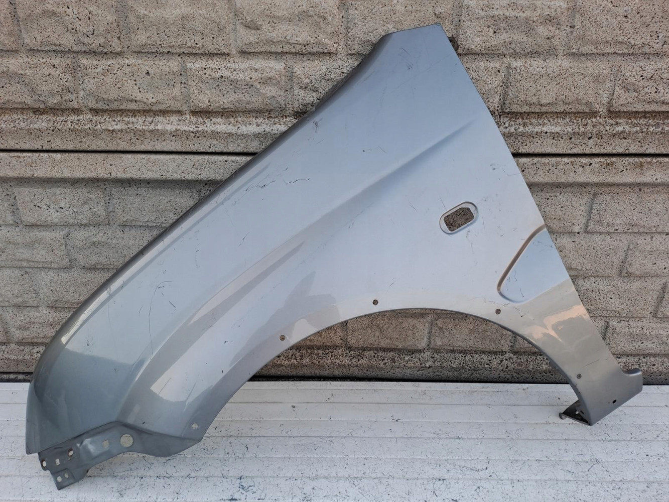 SUZUKI IGNIS II 2 2003-2010 BŁOTNIK PRZEDNI LEWY - (16332802834)