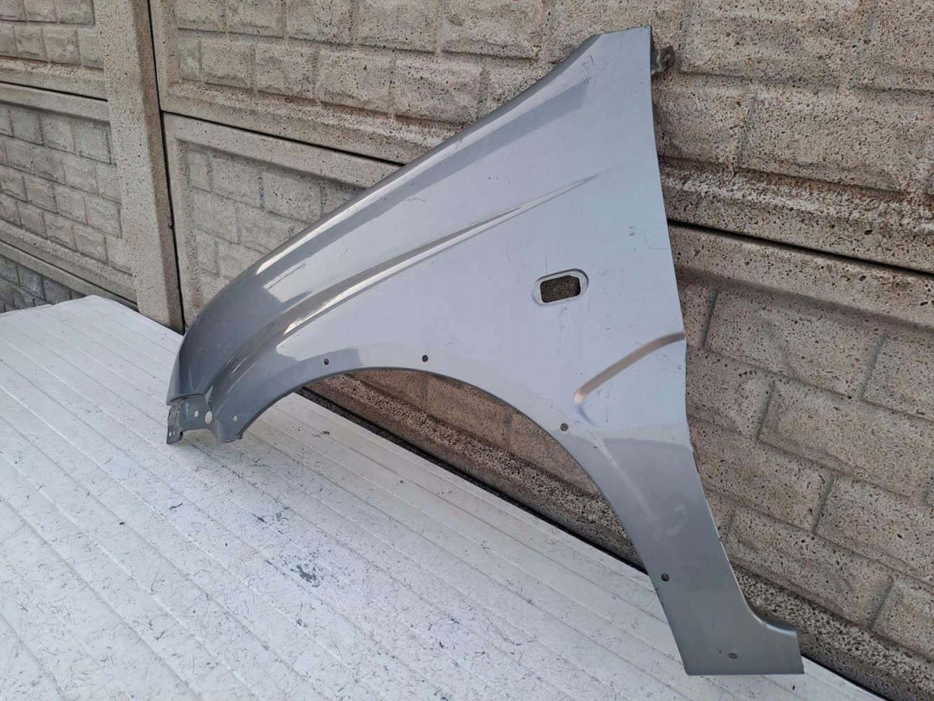 SUZUKI IGNIS II 2 2003-2010 BŁOTNIK PRZEDNI LEWY - (16332802834)
