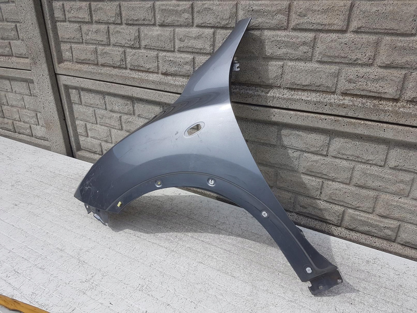 NISSAN JUKE 10-15 BŁOTNIK PRZEDNI LEWY - (12152757133)