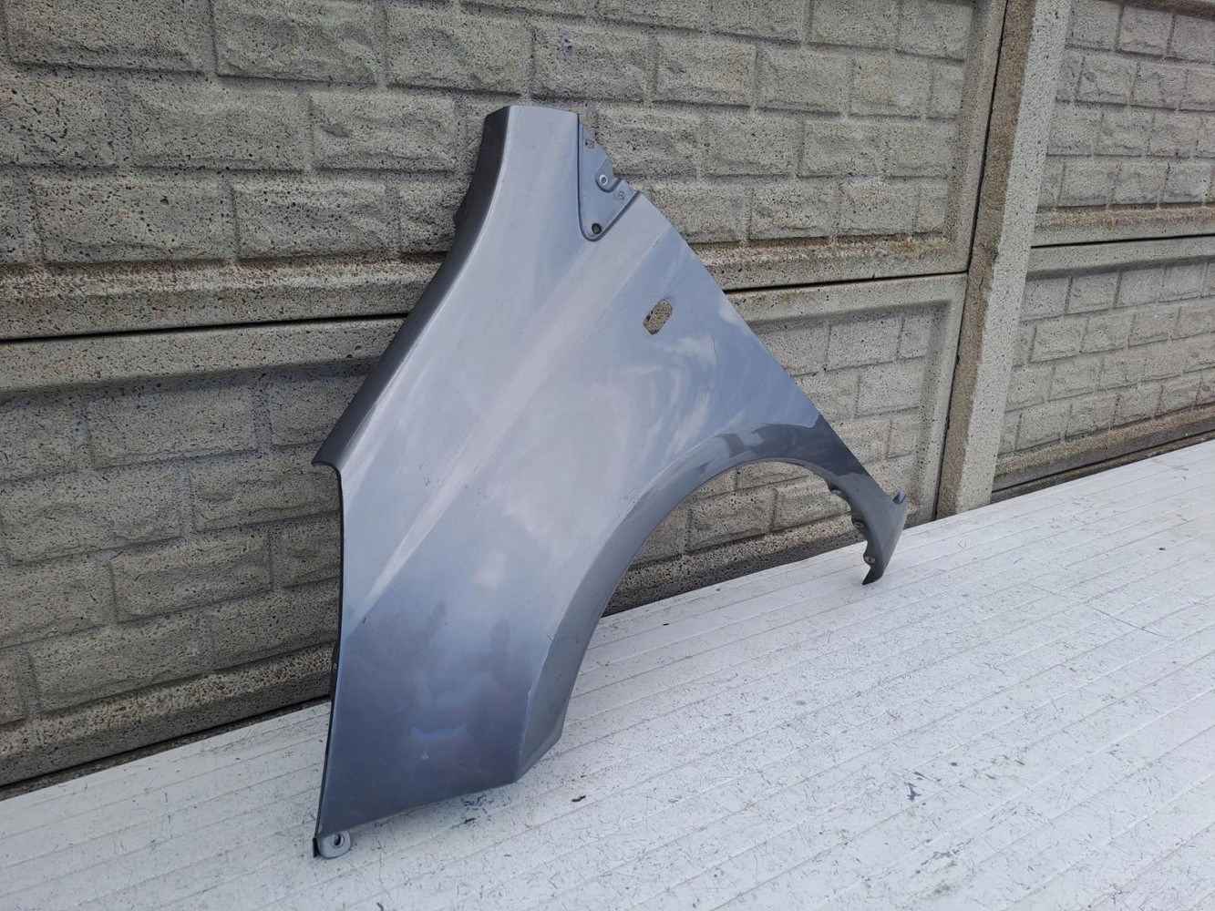 NISSAN NOTE 2006 - 2012 BŁOTNIK PRZEDNI LEWY - (17090011412)