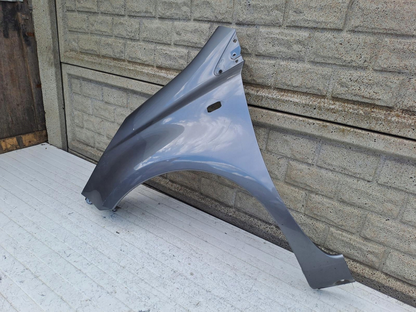 NISSAN NOTE 2006 - 2012 BŁOTNIK PRZEDNI LEWY - (17090011412)