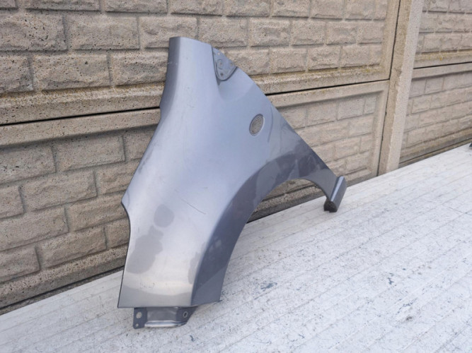NISSAN PIXO SUZUKI ALTO BŁOTNIK LEWY PRZEDNI - (17116640713)