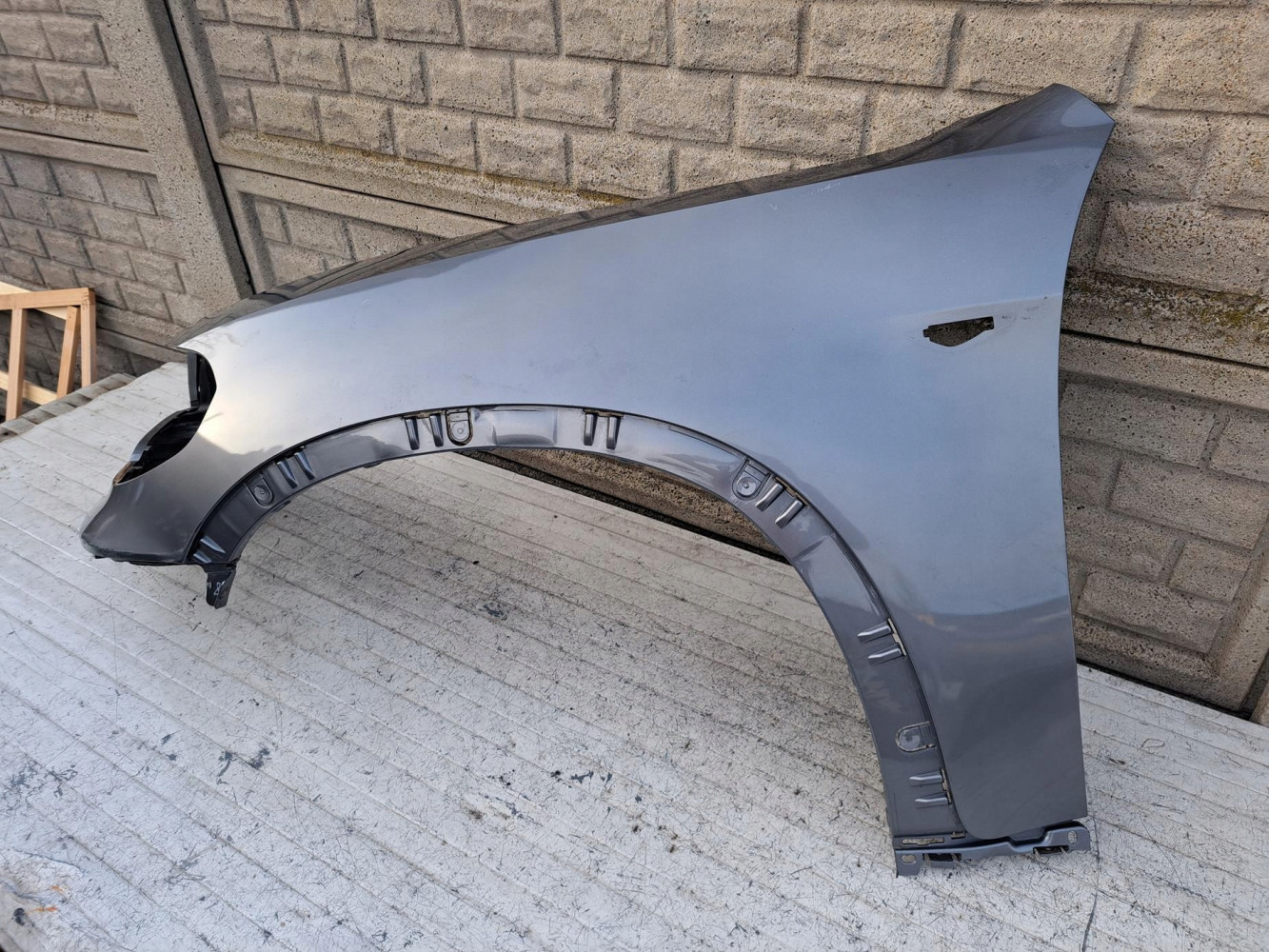 BMW X5 E70 LIFT 2010- BŁOTNIK PRZEDNI LEWY - (17207727454)