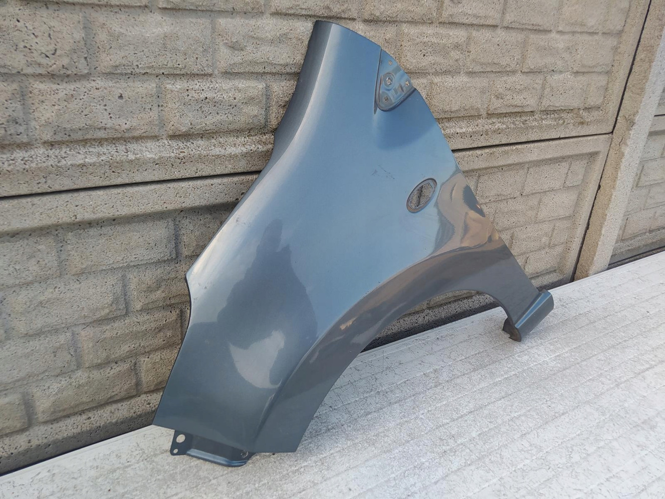 NISSAN PIXO SUZUKI ALTO BŁOTNIK LEWY PRZEDNI - (12223836517)