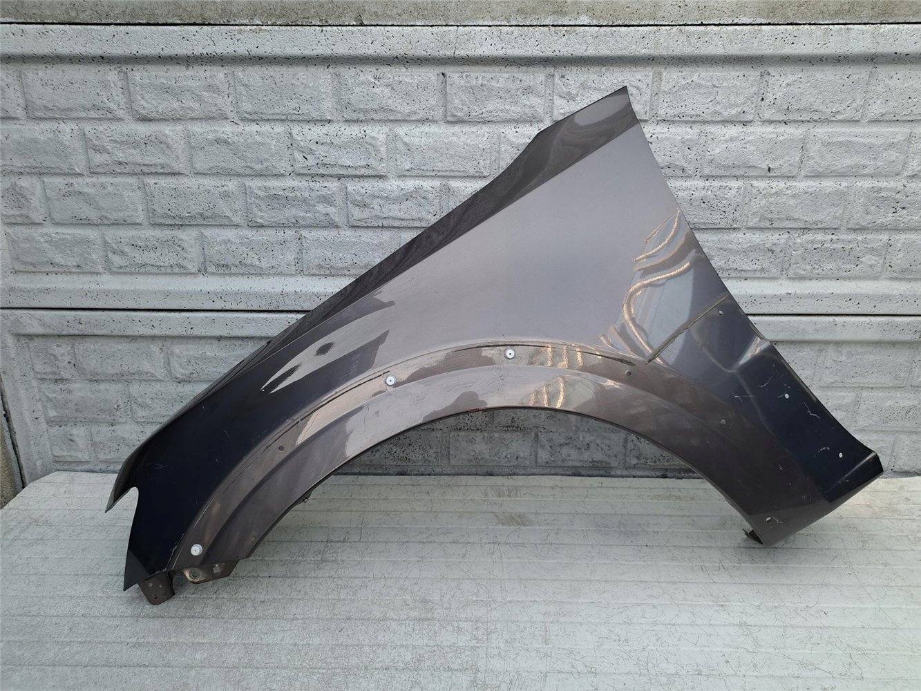 MITSUBISHI PAJERO 06 - 17 BŁOTNIK PRZEDNI LEWY ORYGINAŁ (17357154400)