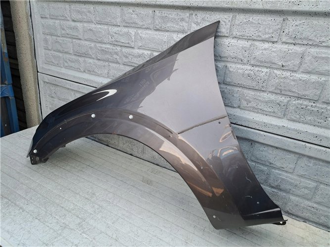 MITSUBISHI PAJERO 06 - 17 BŁOTNIK PRZEDNI LEWY ORYGINAŁ (17357154400)