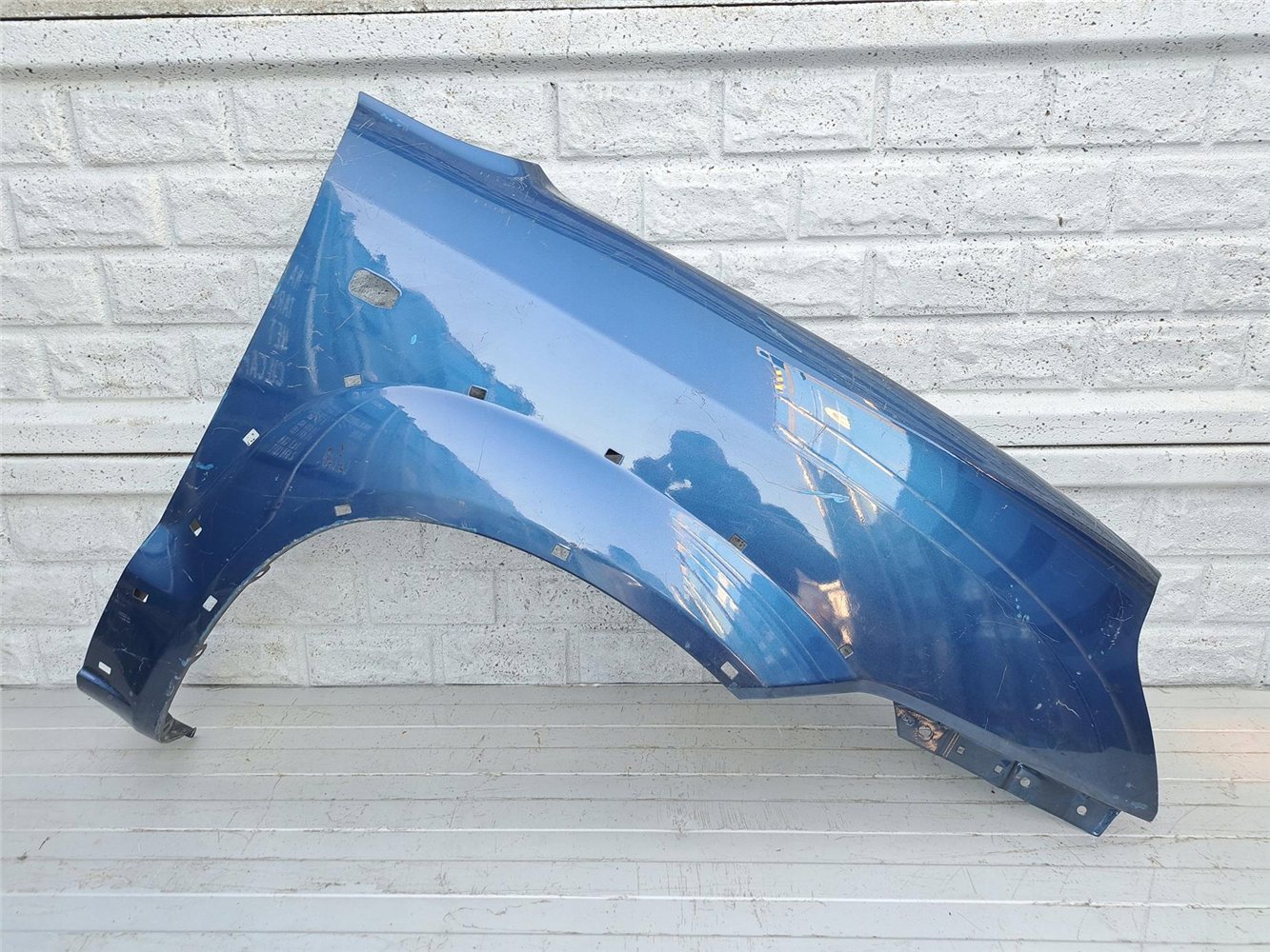 HYUNDAI TUCSON 04-09 BŁOTNIK PRAWY PRZÓD ORYGINAŁ (17357392432)