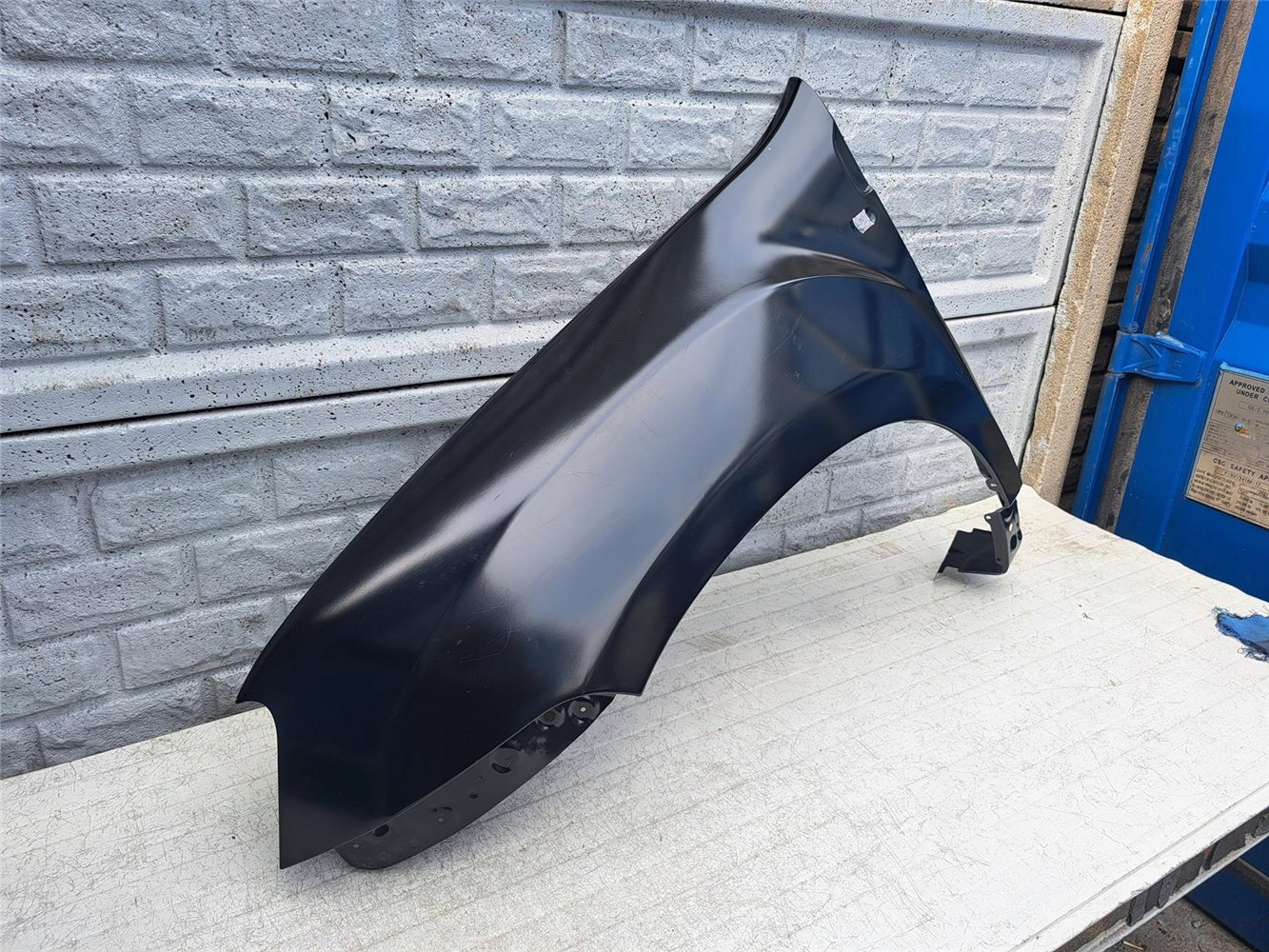 DACIA DUSTER I 1 BŁOTNIK LEWY PRZEDNI NOWY ORYGINAŁ (17387313260)