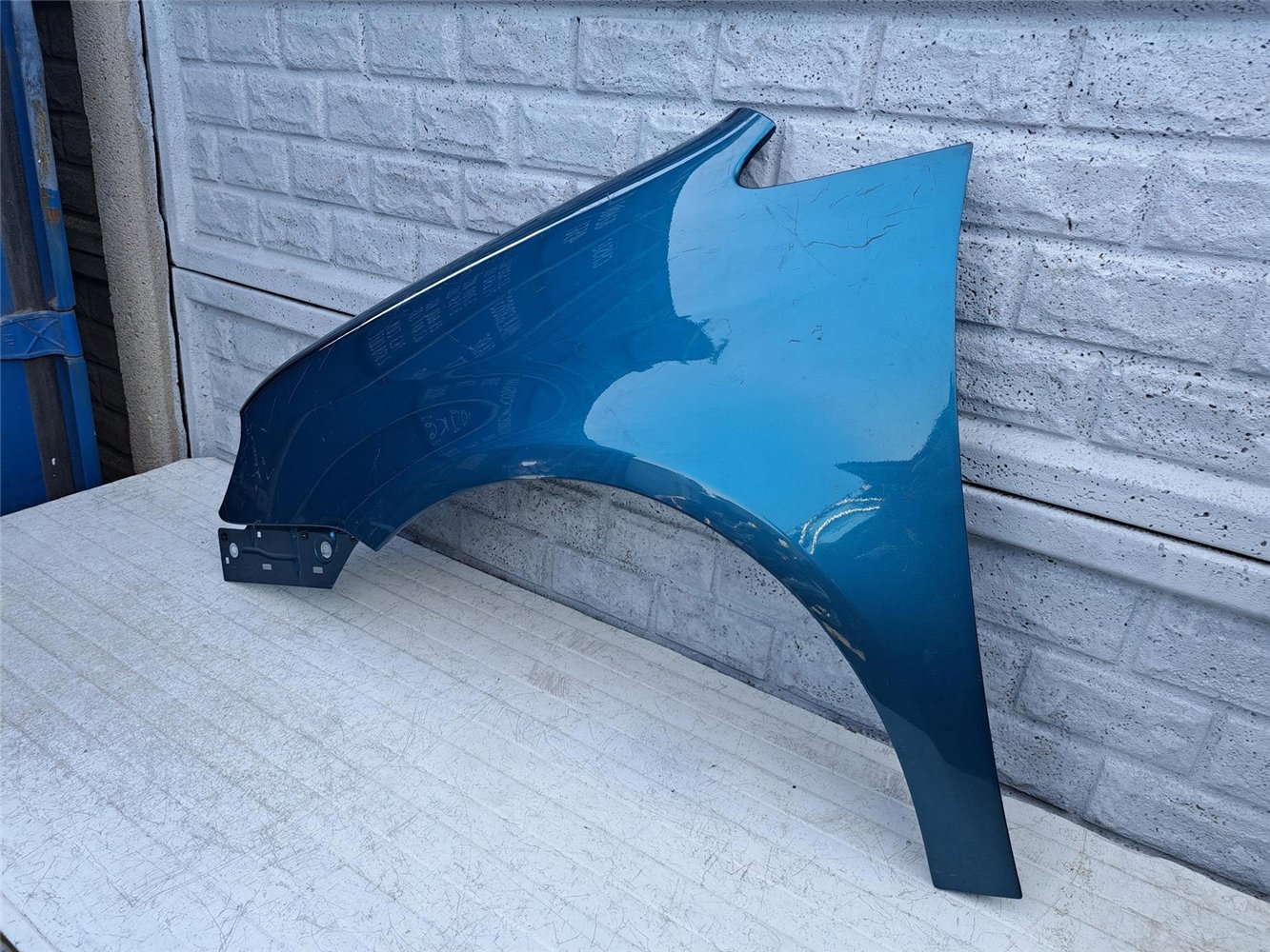 BŁOTNIK PRZEDNI LEWY VW TOURAN 2003 - 2010 ORYGINAŁ (17414211920)