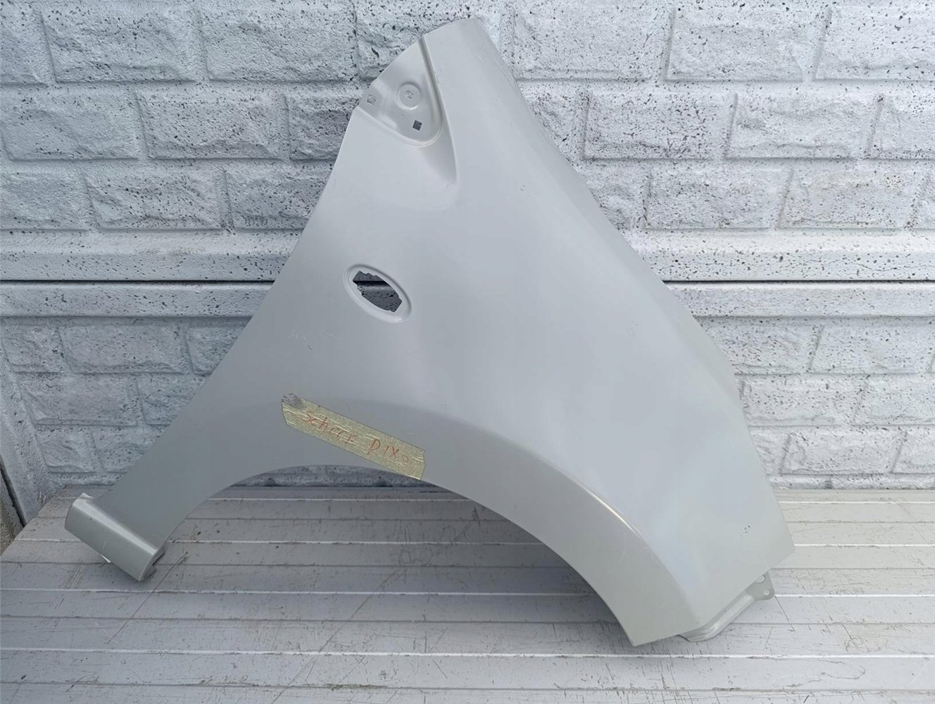 NISSAN PIXO SUZUKI ALTO BŁOTNIK PRAWY PRZEDNI NOWY ORYGINAŁ (17484597271)