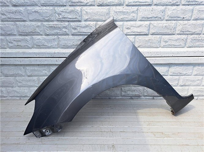 SUZUKI SWIFT MK8 17-23 BŁOTNIK PRZEDNI LEWY ORYGINAŁ (17507402743)