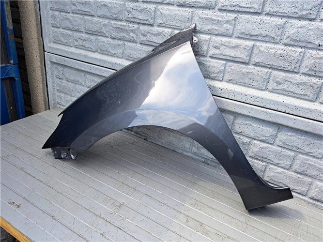 SUZUKI SWIFT MK8 17-23 BŁOTNIK PRZEDNI LEWY ORYGINAŁ (17507402743)