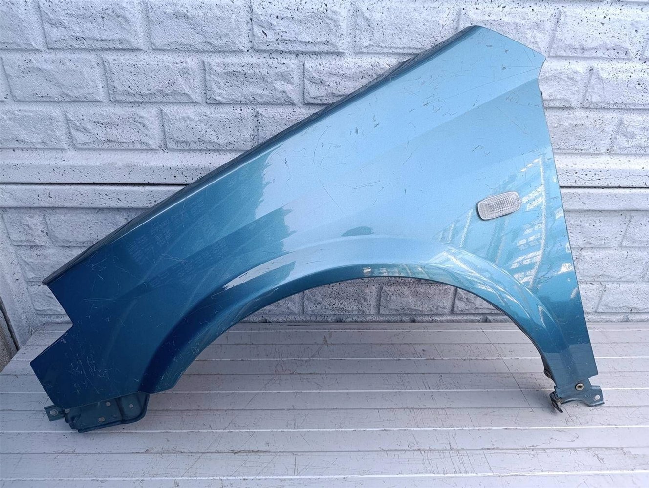 NISSAN PRIMERA BŁOTNIK LEWY PRZÓD ORYGINAŁ (17523023219)