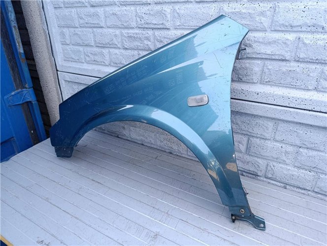 NISSAN PRIMERA BŁOTNIK LEWY PRZÓD ORYGINAŁ (17523023219)