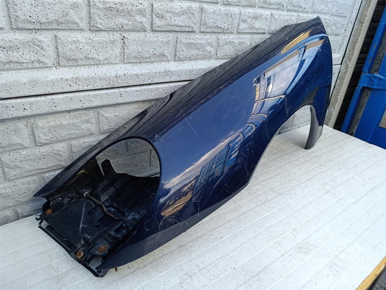 PORSCHE CARRERA 911 996 BŁOTNIK PRZEDNI LEWY ORYGINAŁ (17586098443)