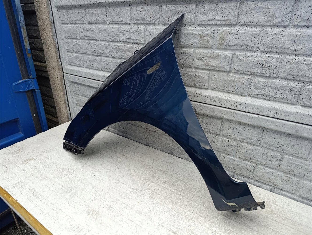 KIA CARENS BŁOTNIK LEWY PRZEDNI ORYGINAŁ (17594808635)