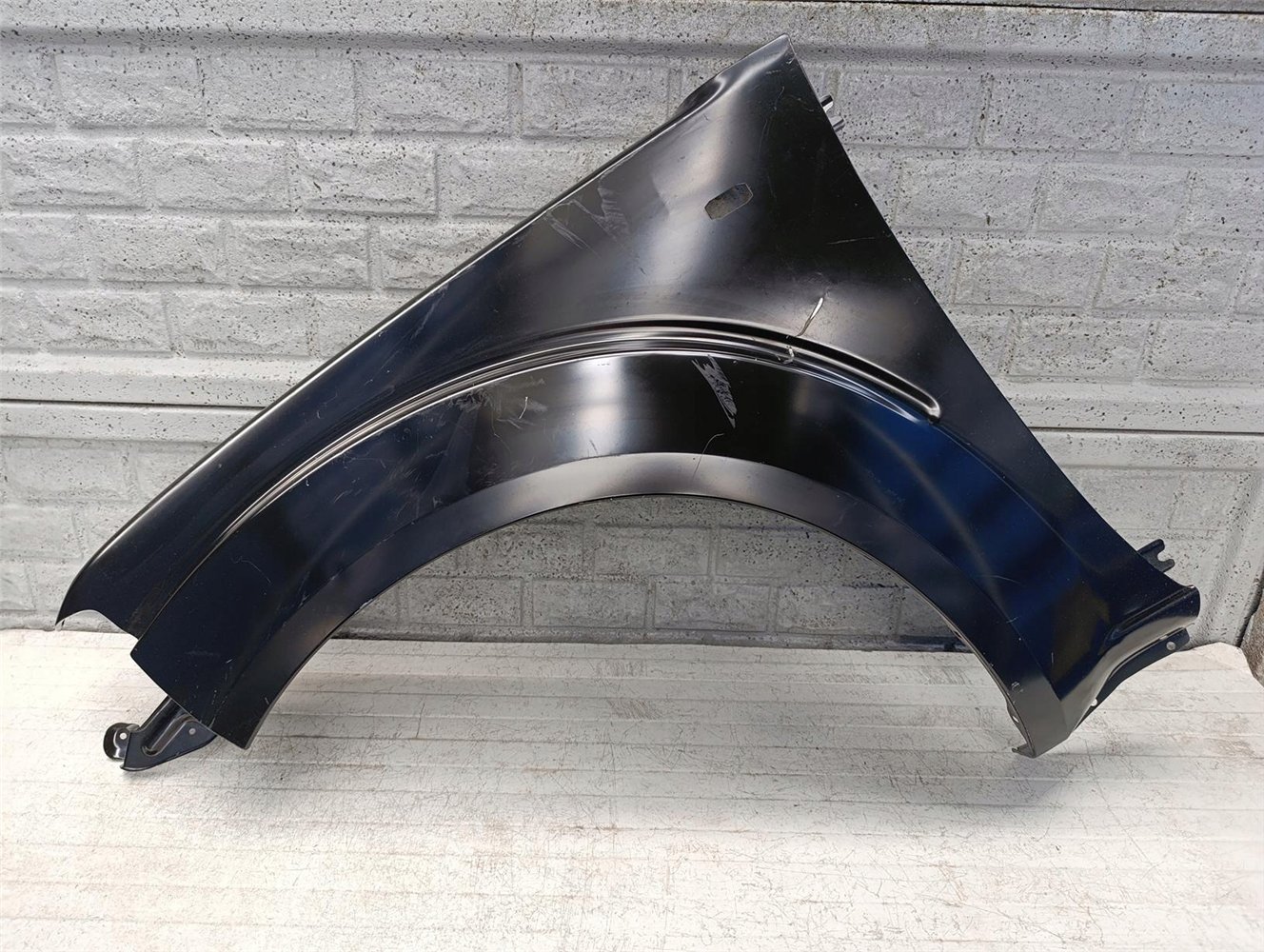 NISSAN NAVARA PATHFINDER D40 BŁOTNIK LEWY NOWY ORYGINAŁ (17618568740)