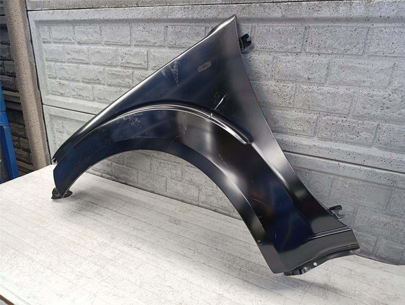 NISSAN NAVARA PATHFINDER D40 BŁOTNIK LEWY NOWY ORYGINAŁ (17618568740)