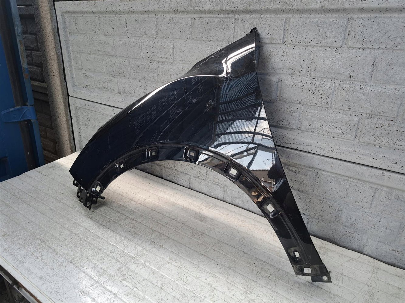 SSANGYONG TIVOLI 2015-19 BŁOTNIK LEWY PRZEDNI ORYGINAŁ (17672095506)