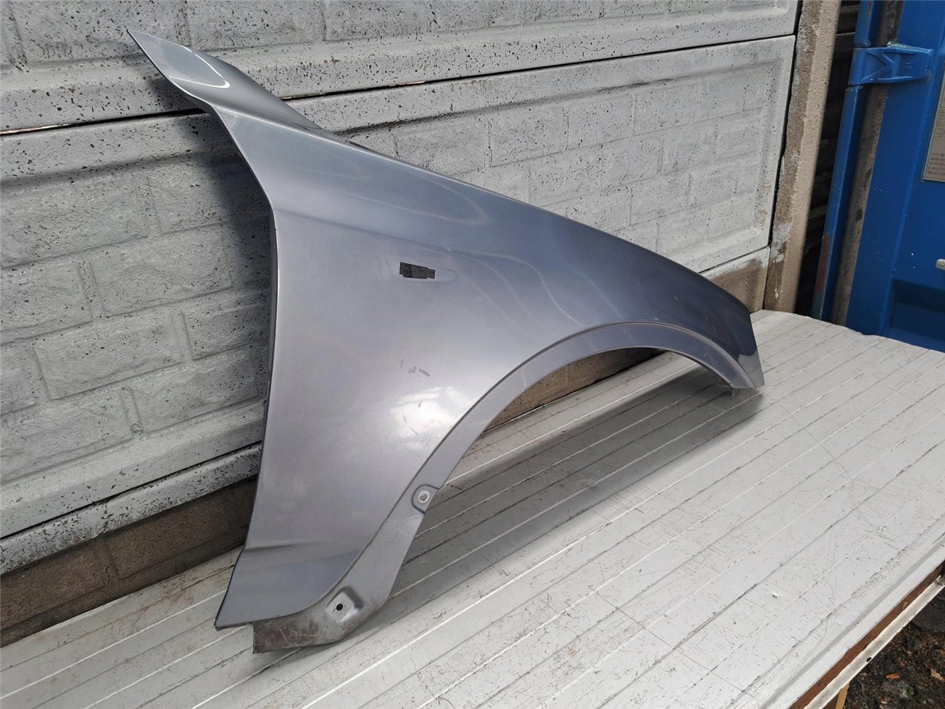 BMW X3 E83 LIFT BŁOTNIK PRAWY PRZEDNI ORYGINAŁ (17718216941)