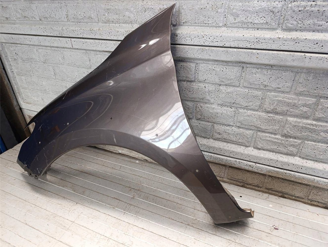 MITSUBISHI L200 FIAT FULLBACK 14-20 BŁOTNIK LEWY ORYGINAŁ (17817101813)