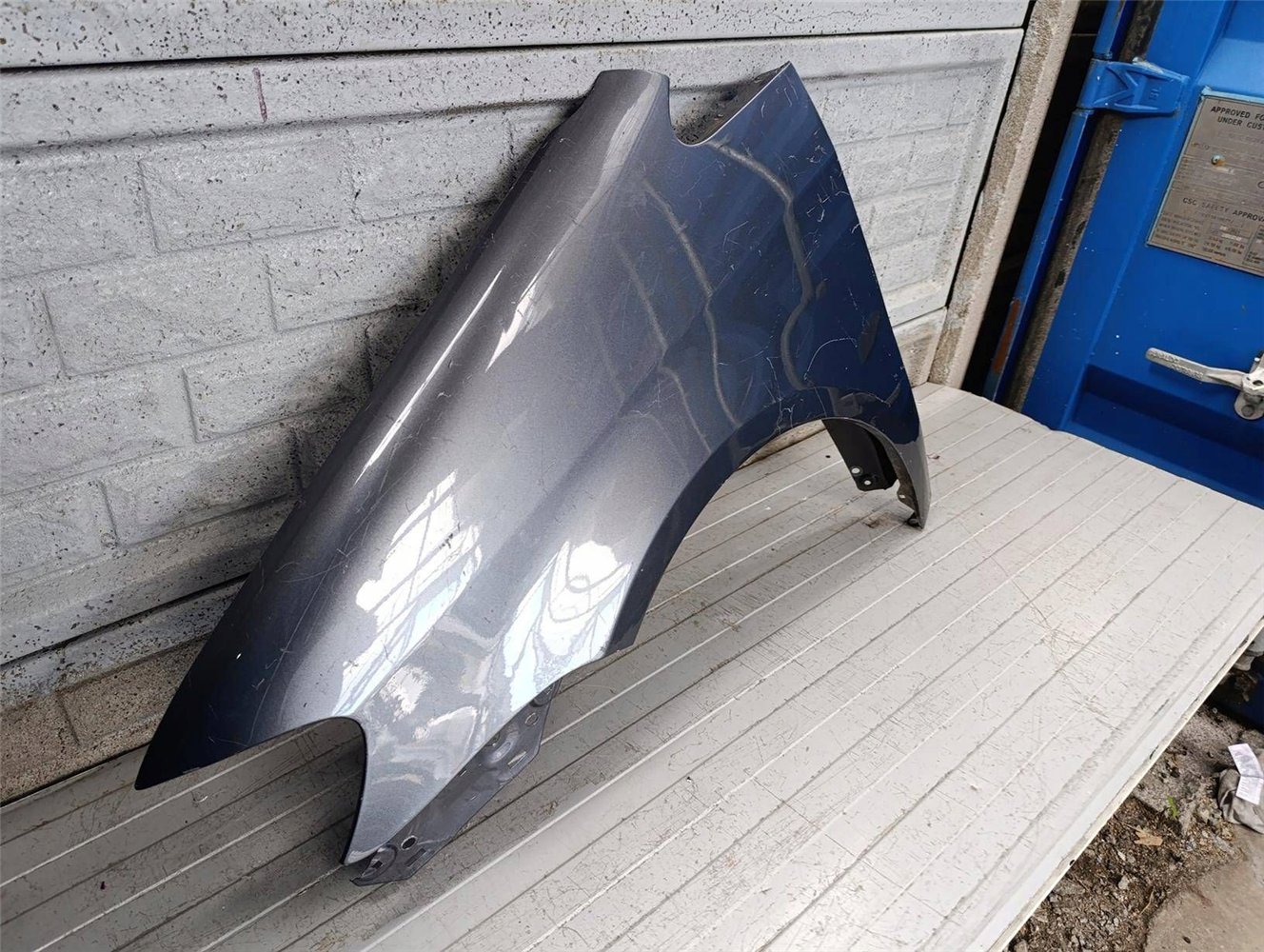 VW TOURAN LIFT BŁOTNIK LEWY 2007-2010 ORYGINAŁ (17817160056)