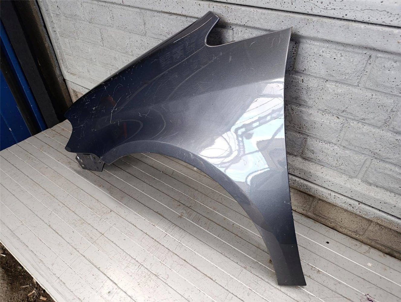 VW TOURAN LIFT BŁOTNIK LEWY 2007-2010 ORYGINAŁ (17817160056)