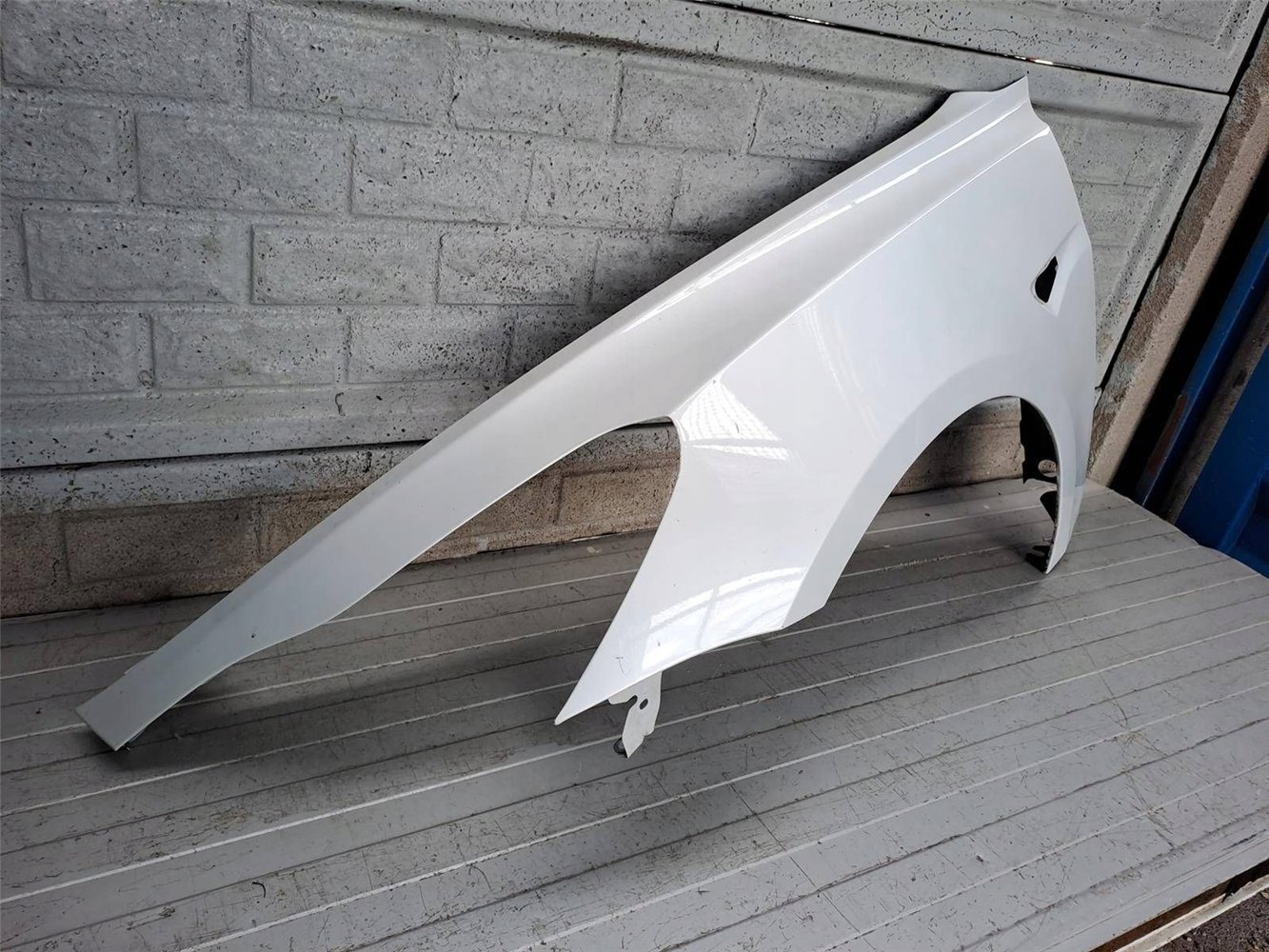 TESLA 3 III 2017-2022 BŁOTNIK PRZEDNI LEWY ORYGINAŁ (17819995346)