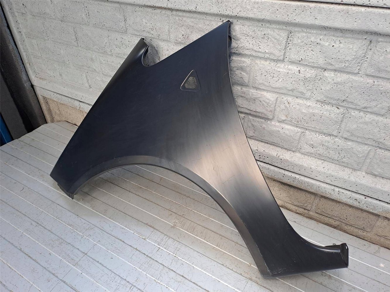 MITSUBISHI COLT 5D 03-08 BŁOTNIK PRZEDNI LEWY NOWY ORYGINAŁ (17828056880)