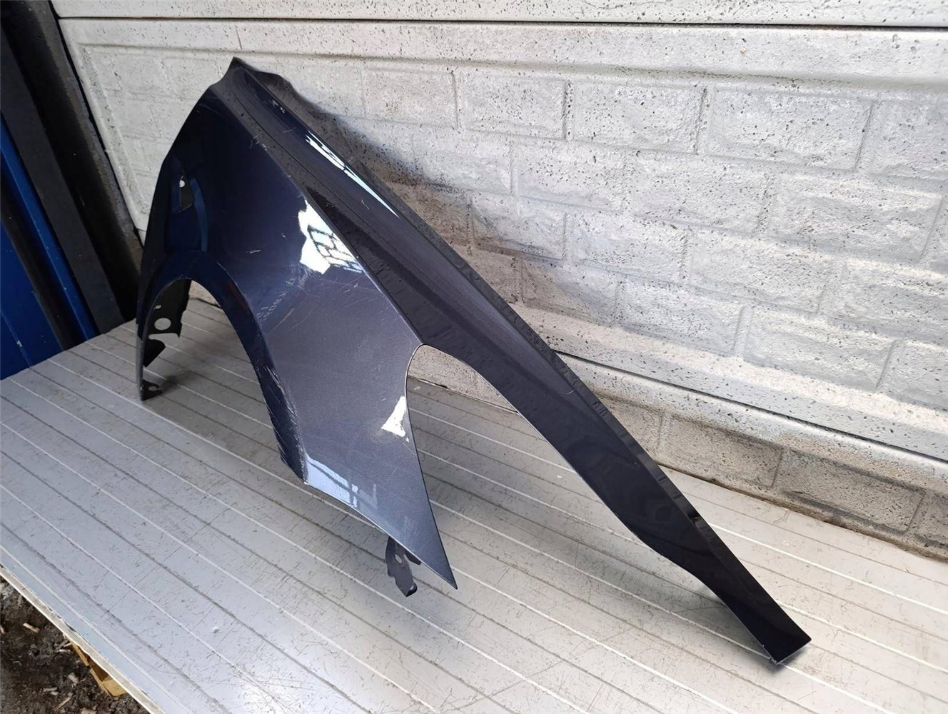 TESLA 3 III 2017-2023 BŁOTNIK PRZEDNI PRAWY ORYGINAŁ (17834070392)