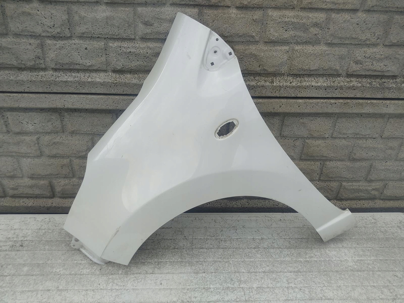 NISSAN PIXO SUZUKI ALTO BŁOTNIK LEWY PRZEDNI - (12349735403)