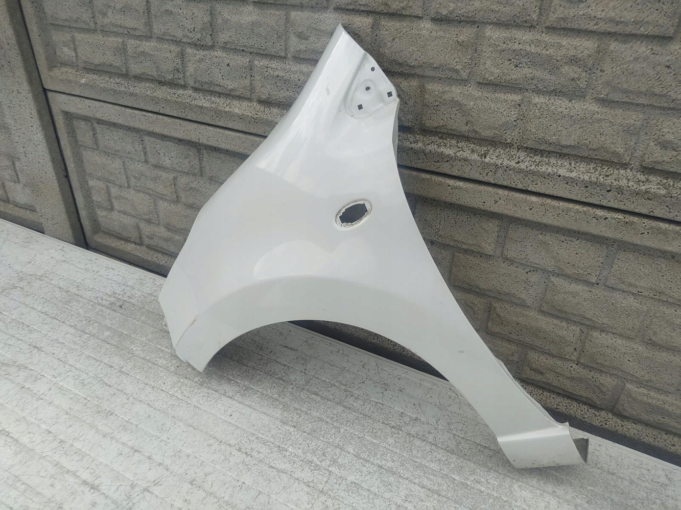 NISSAN PIXO SUZUKI ALTO BŁOTNIK LEWY PRZEDNI - (12349735403)