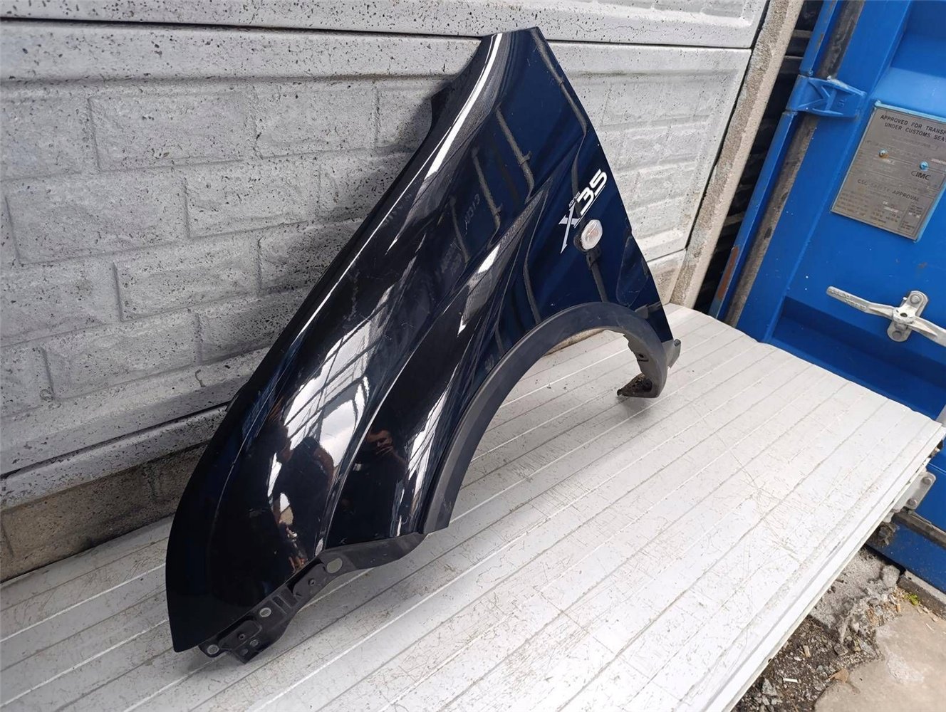 SUZUKI IGNIS II 2 2003-2010 BŁOTNIK PRZEDNI LEWY ORYGINAŁ (17854718441)