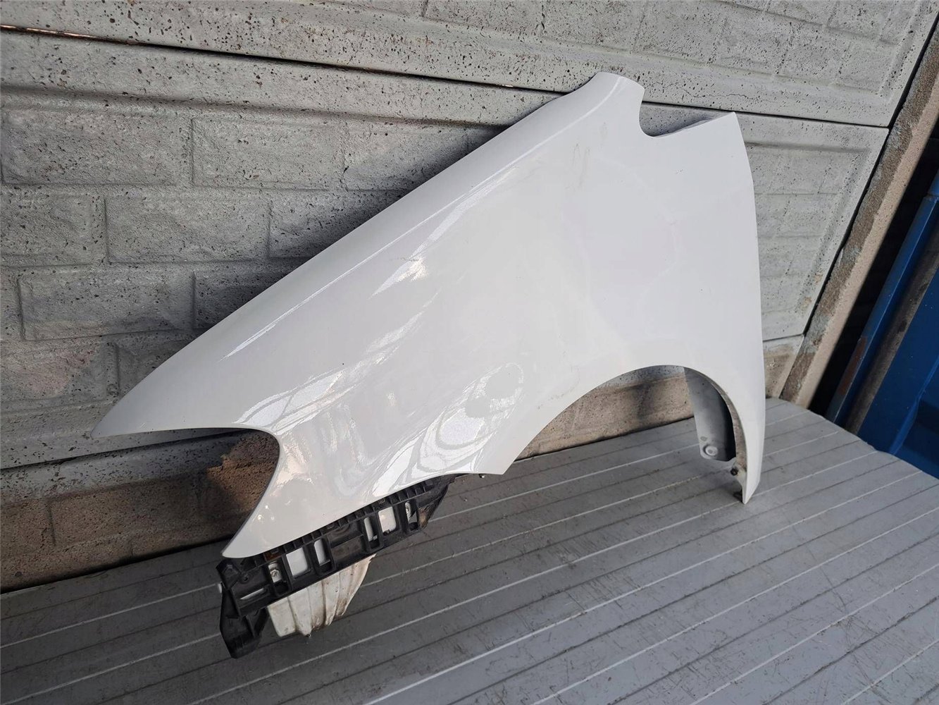 VW TOURAN LIFT BŁOTNIK LEWY 2007-2010 ORYGINAŁ (17883095473)