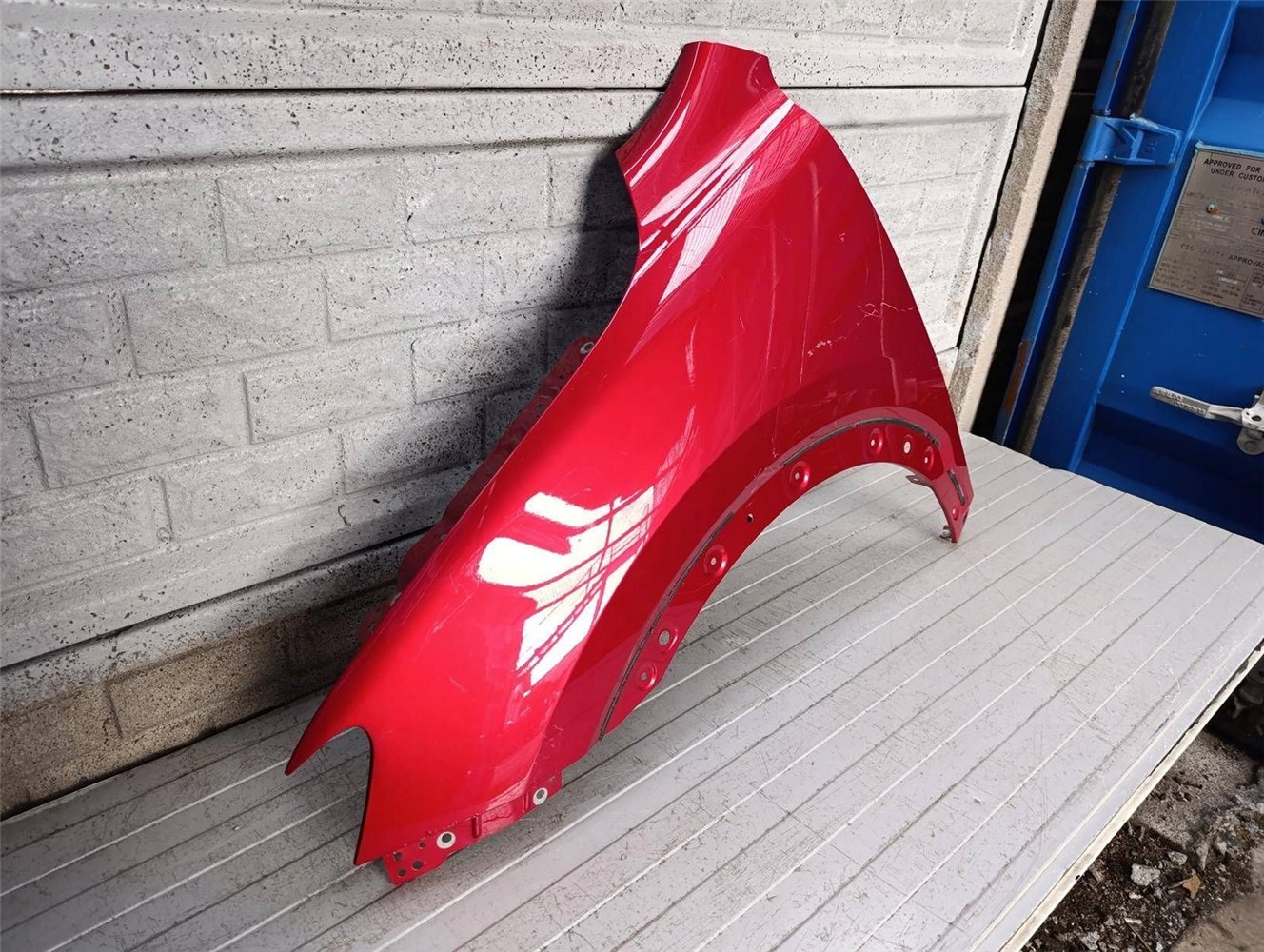 MG HS 18- BŁOTNIK PRZEDNI LEWY ORYGINAŁ (17900627947)