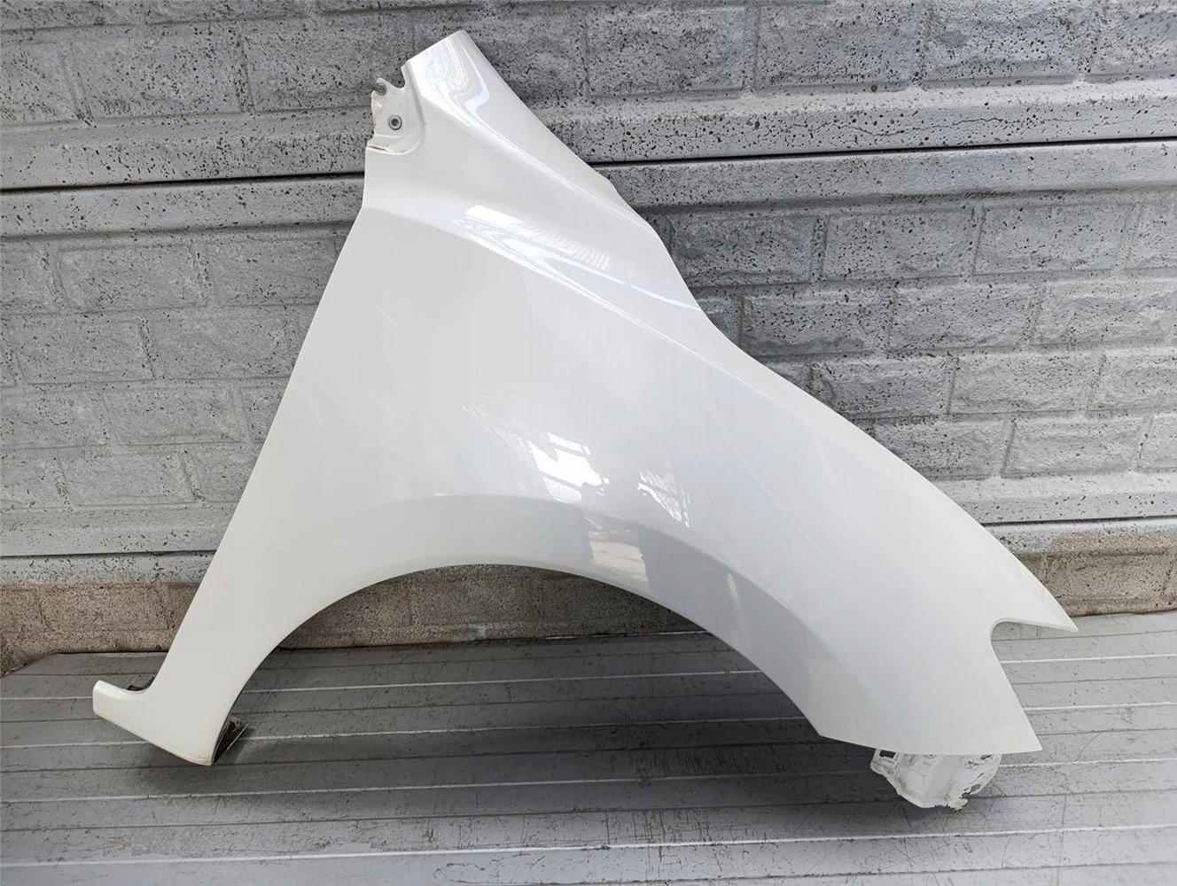 BŁOTNIK PRAWY PRZEDNI NISSAN PULSAR ORYGINAŁ (17900662509)