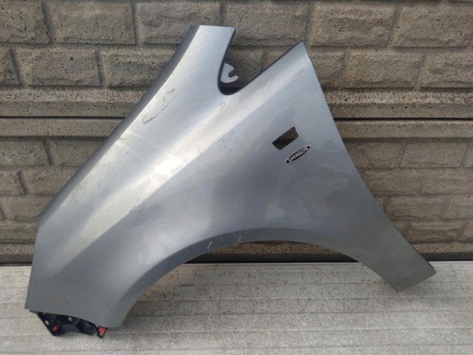 BŁOTNIK LEWY OPEL CORSA D 2006-2015 - (12516524289)