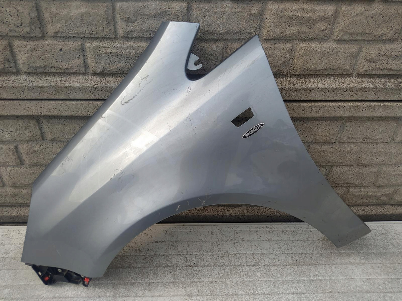 BŁOTNIK LEWY OPEL CORSA D 2006-2015 - (12516524289)