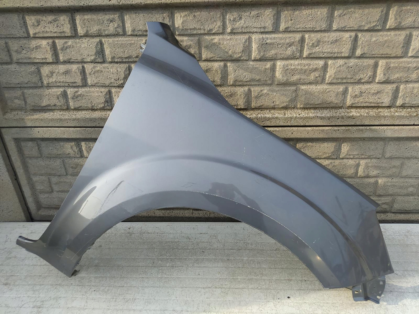 NISSAN NAVARA IV 16-22 BŁOTNIK PRZEDNI PRAWY - (12654338159)